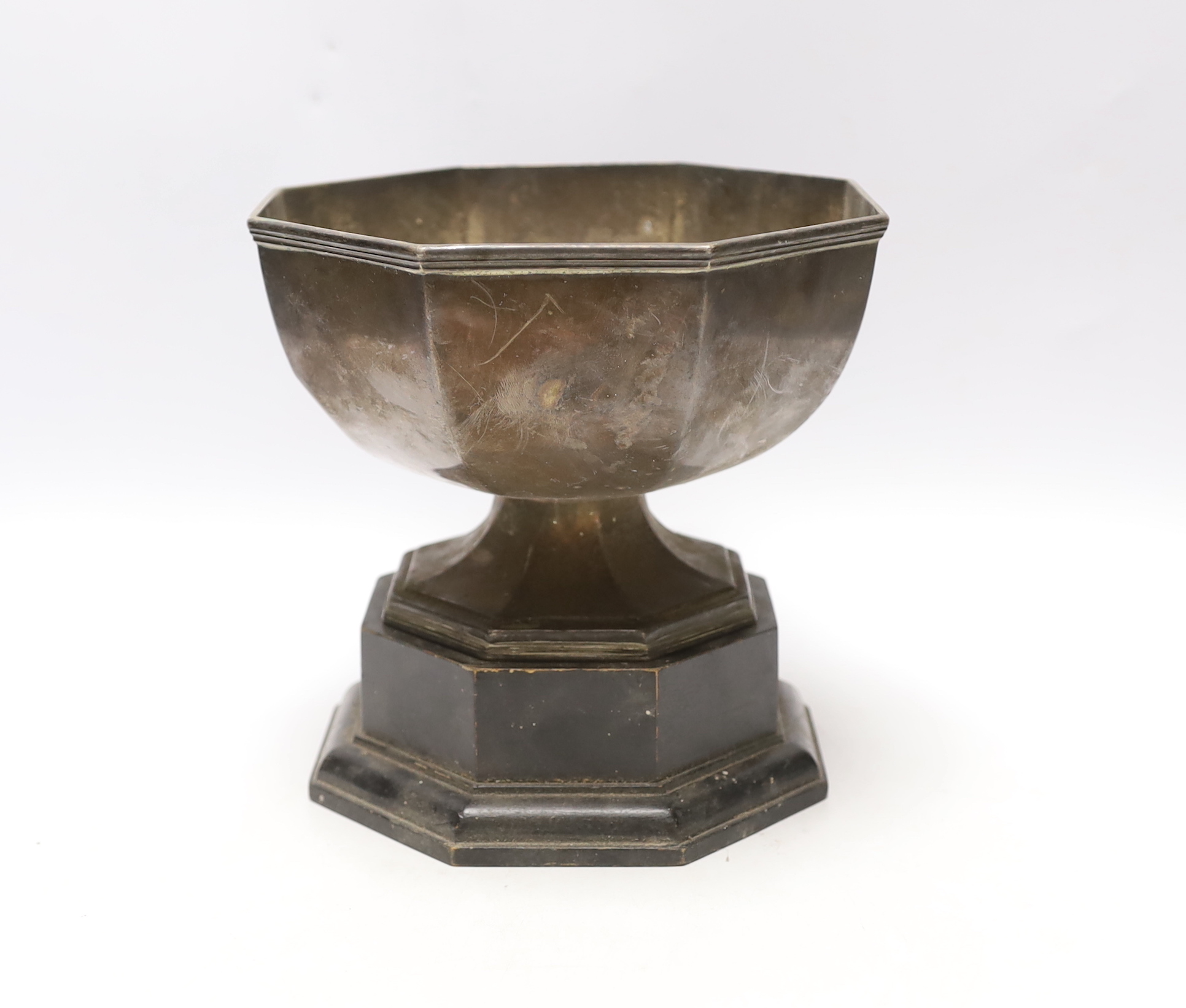 A George V silver octagonal presentation trophy bowl, John Henry Potter, Sheffield, 1930, diameter 18.2cm, 17oz, on an ebonised plinth base.